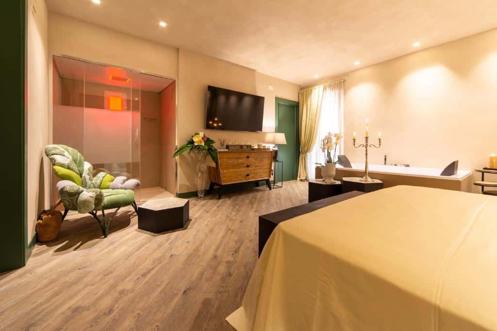 Stylish room featuring a king-size bed, modern decor, and a relaxing spa bathtub with candles.