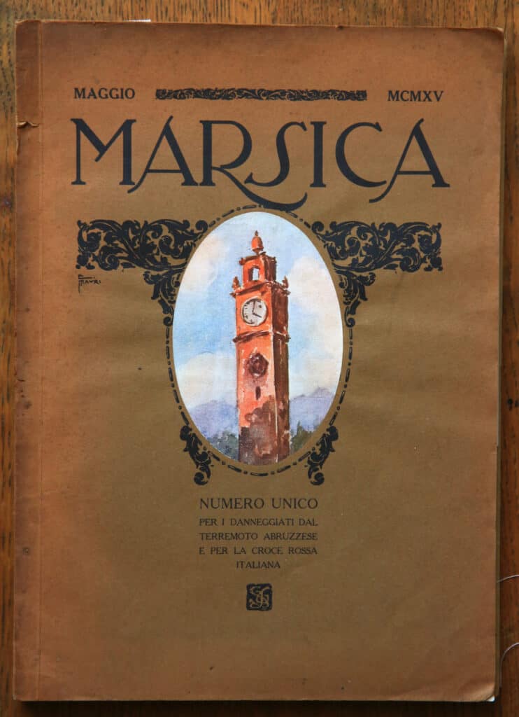 An illustrated vintage book cover featuring a historic clock tower in Abruzzo, Italy, amidst decorative elements and Italian text.